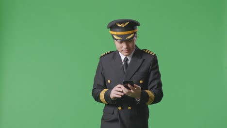 pilot looking at phone