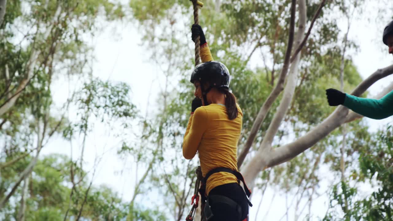 Woman swinging on a rope 4k