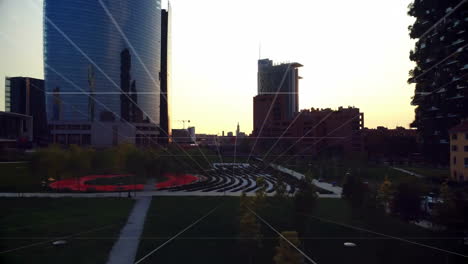 park glowing at sunset featuring paved path toward seating and reflective tower 3d render