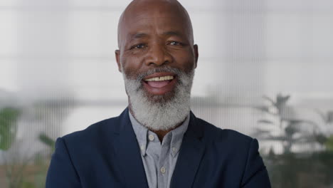 portrait-happy-senior-businessman-executive-laughing-enjoying-successful-career-black-middle-aged-professional-entrepreneur-wearing-suit-in-office-slow-motion