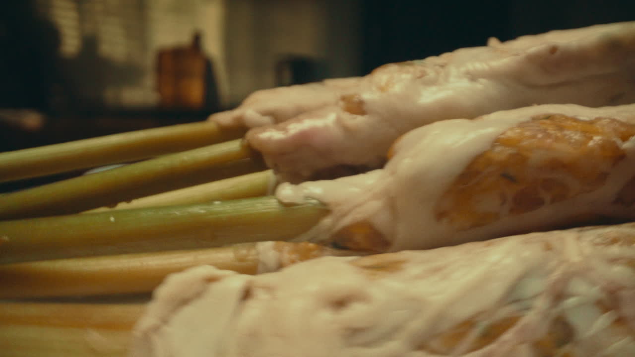 Rotating table with glazed food in motion blur, creating a dynamic and appetizing view