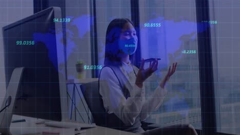 Animation-of-financial-data-processing-over-asian-businesswoman-with-face-mask-in-office