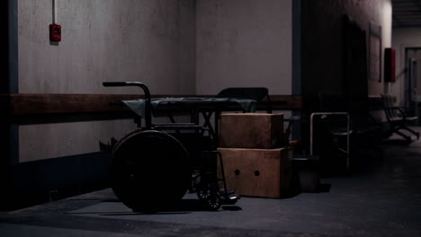 quiet hallway with a wheelchair and boxes in an abandoned building