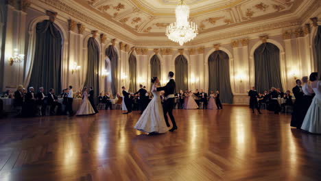 elegant couple dancing at a formal ballroom gala