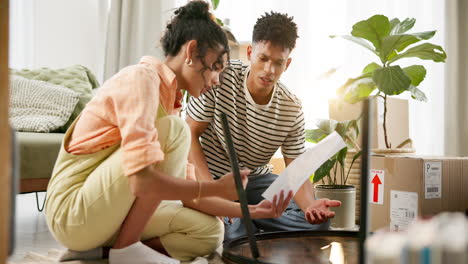 couple assembling furniture in their new apartment