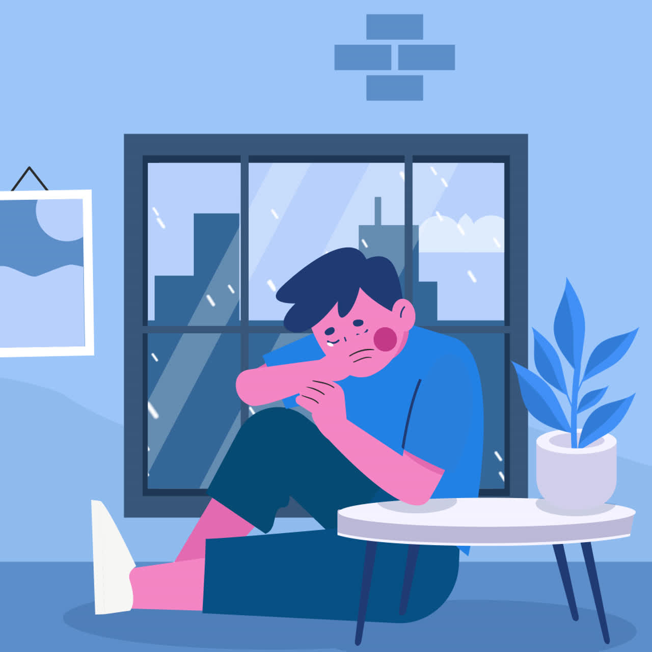 Sad boy sitting by the window on a rainy day