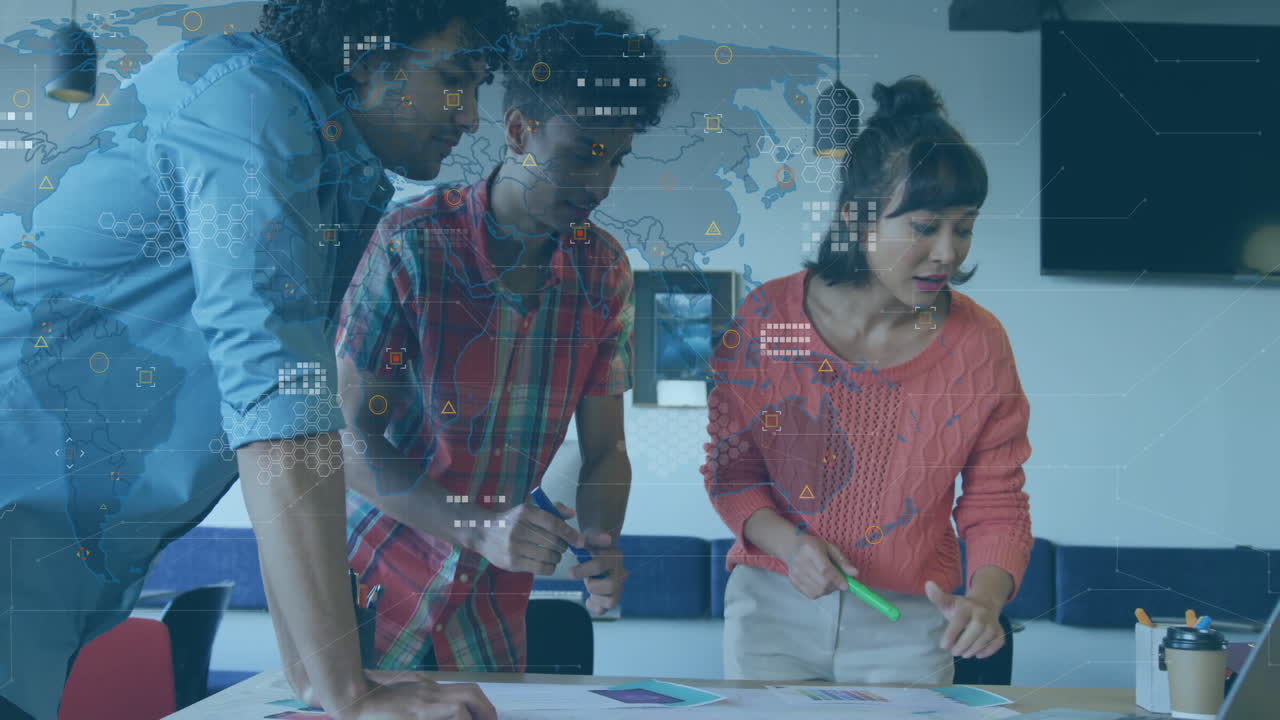 Collaborating on animation project, diverse team using digital world map in school