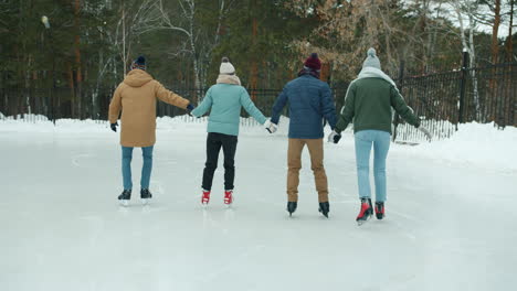 friends ice skating in winter