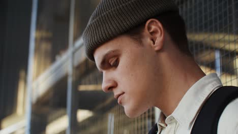 young man enjoying coffee outdoors