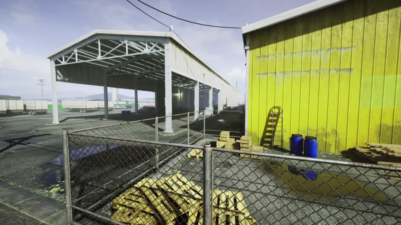 Industrial setting in a warehouse area with yellow building and storage