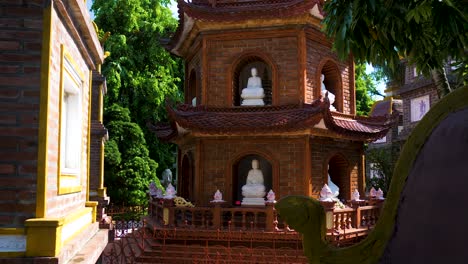 panning reveal of some religious statues and artefacts at tran quoc pagoda temple