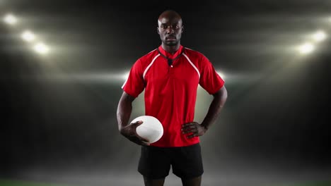 jugador de rugby profesional de pie frente a un reflector