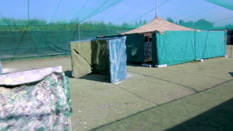 girls and boys playing paintball in an outdoor arena-2