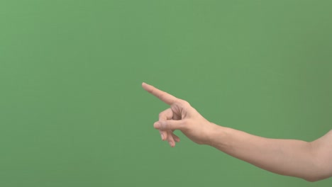 side view to female hand gesturing no, prohibition, denial sign. woman raising one finger up and make disapproving gesture on green screen chroma key background. negative emotion, disagree sign. 4k