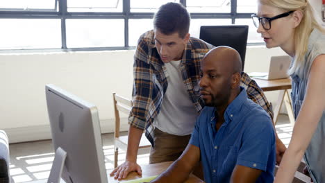 casual colleagues using a computer