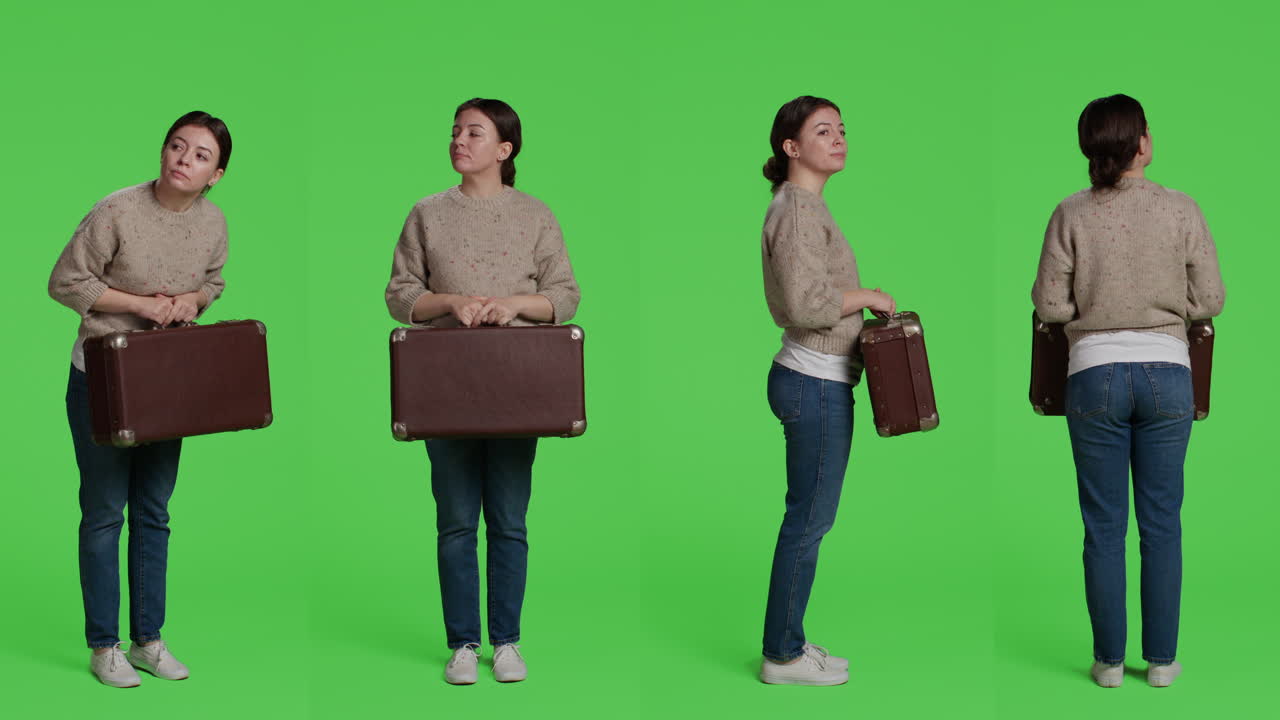Woman Holding a Vintage Suitcase in Studio Shot