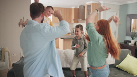 dance, happy and family having fun in the living