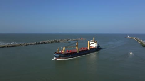 aerial view of an ocean liner vessel entering the seaport harbor