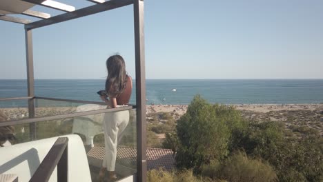 Fashionable-Young-Woman-Looking-At-Ocean-View