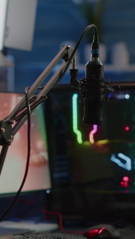 gaming and streaming setup with rgb pc and studio microphone