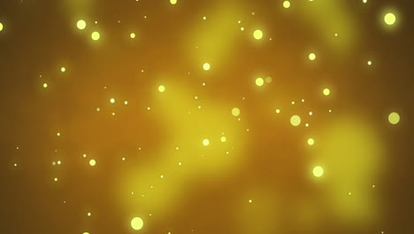 glowing yellow flashing christmas light particles and bokeh lights moving across dark background