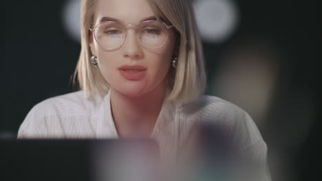 successful girl working on laptop. financial analyst working late at workplace
