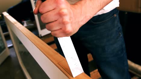 carpenter working on a wooden door