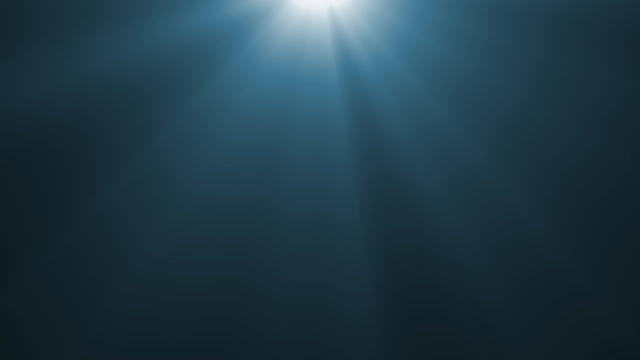Soft, cinematic blue volumetric light rays gently drift from top of frame. Ideal for moody intros, underwater scenes, or abstract visuals