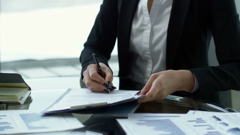 businesswoman in a meeting with coworkers sitting at a table 1