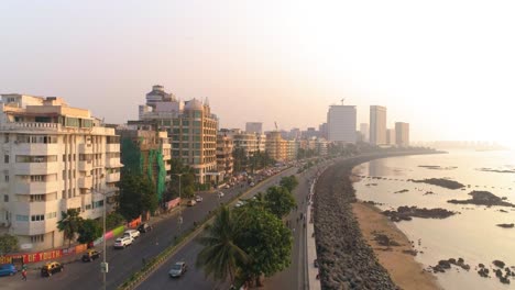 drone shots of the most iconic walkway of south bombay, marine drive, also known as the queen's necklace as seen before the great mumbai coastal road is made