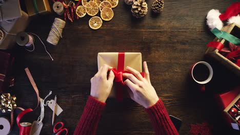 person wrapping christmas gifts