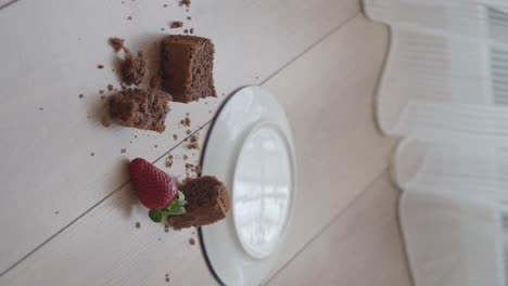 chocolate cake and strawberries on wooden table