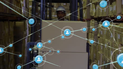 Animation-of-network-of-connections-with-icons-over-biracial-man-working-in-warehouse