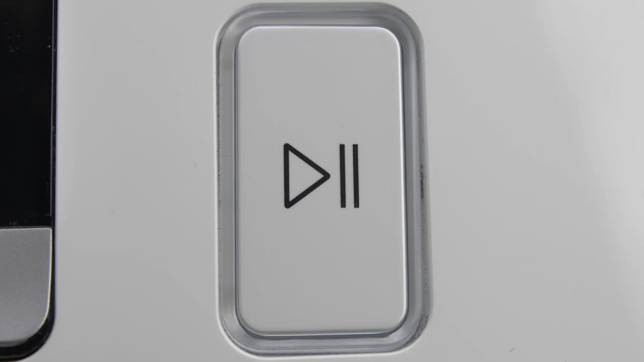 Pressing Play Pause Button on the Device Multiple Times Close-Up