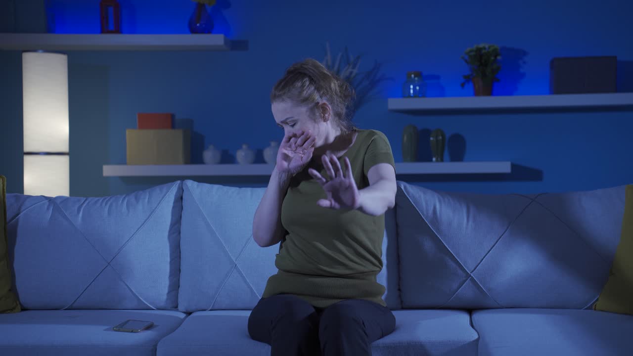 Woman looking at camera with cowardly eyes.