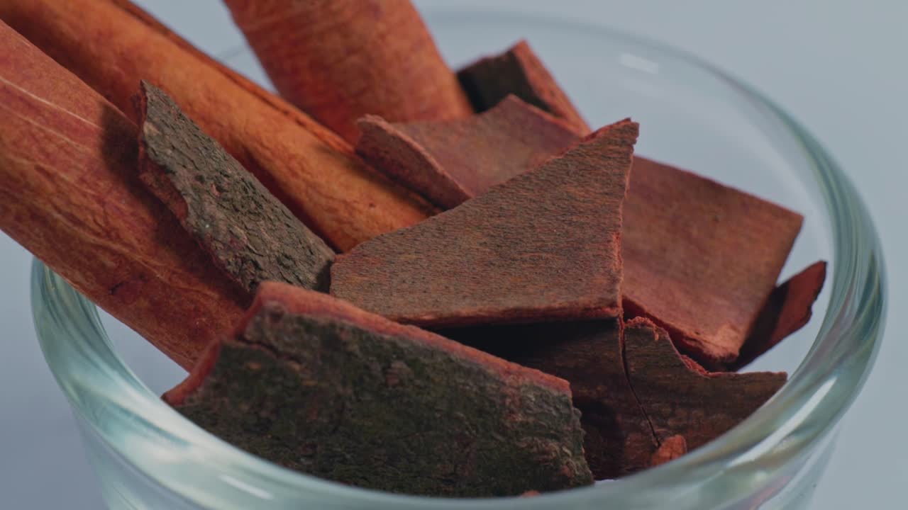 dalchina chekka or cinnamon sticks in small glass bowl, 4k, parallax shot.