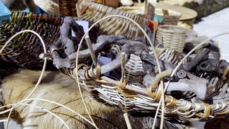 closeup of wooden dark branches woven into carry baskets at lonoa spain on top of fur