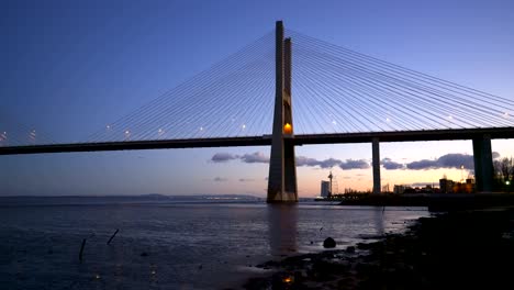 ponte vasco da gama bridge view near the rio tejo river at sunset