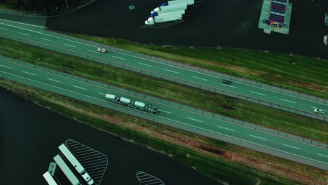 Car-hauler-carriage-semi-truck-with-tree-vans-on-trailer-driving-on-interstate