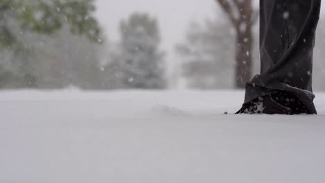 Slow-motion-footage-of-foot-steps-on-snow