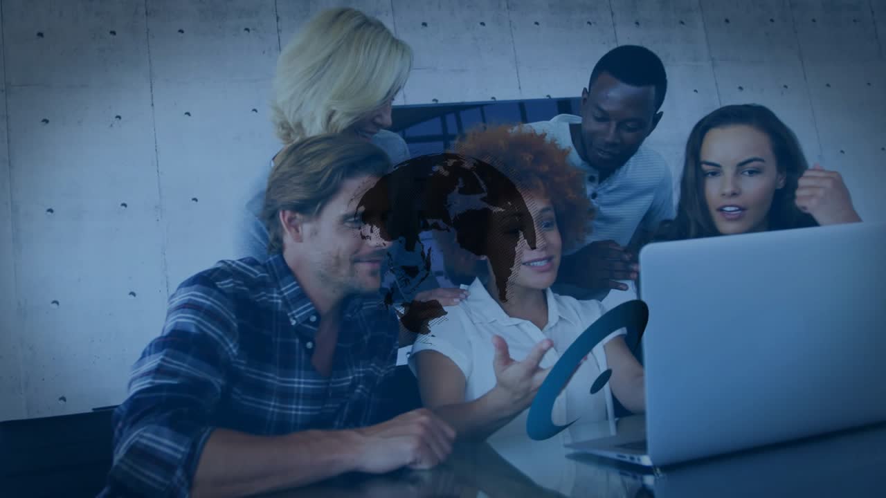 Rotating 3D globe logo animation fading and revealing coworkers reviewing business slides on laptop