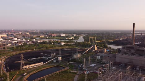 coal-fired power plant by the riverbank - dte river rouge in detroit, michigan - aerial panning shot