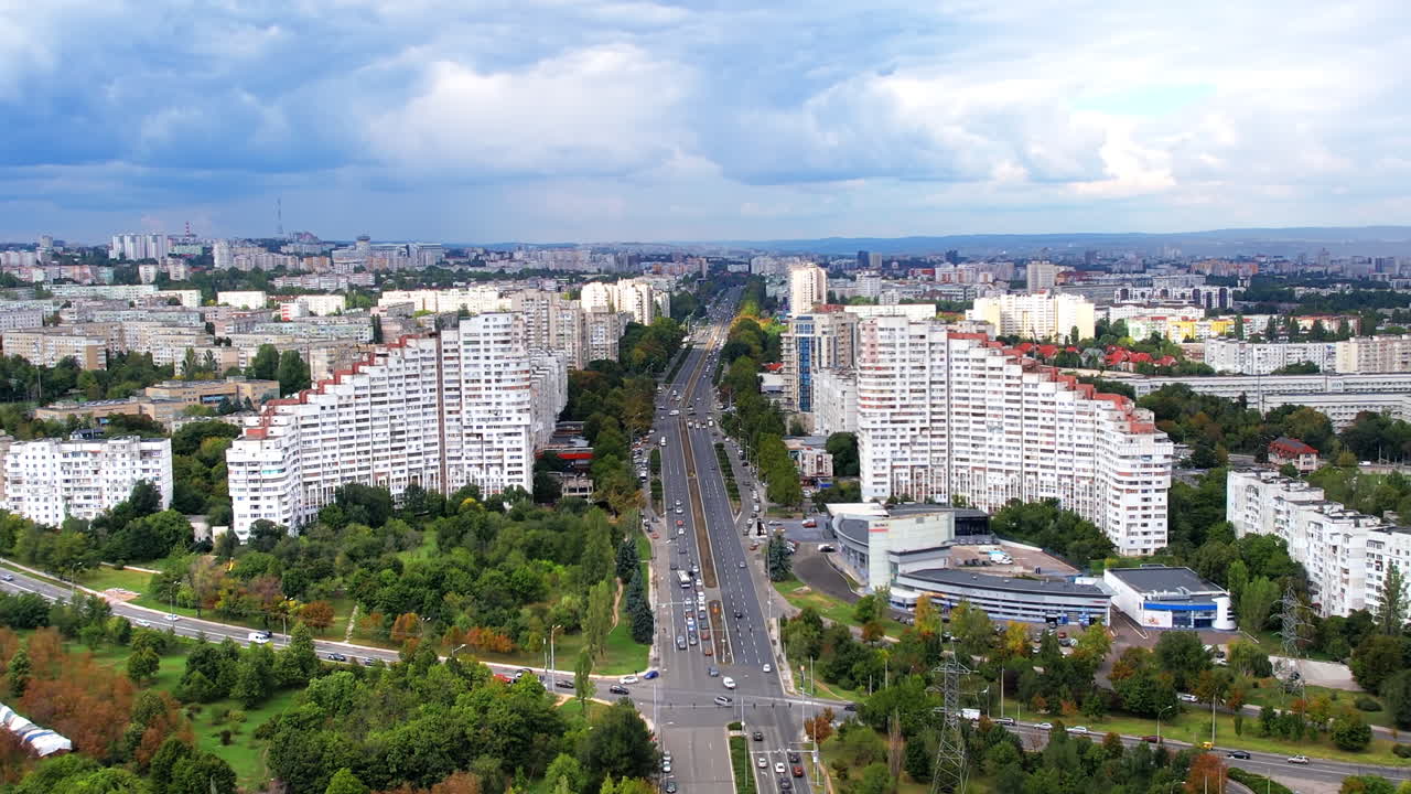 Aerial drone view of Chisinau, Moldova. View of residential district with City Gates, multiple buildings, roads, lush greenery