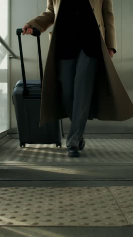 woman walking in an elevator