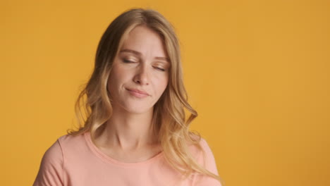 caucasian woman looking bored on camera.