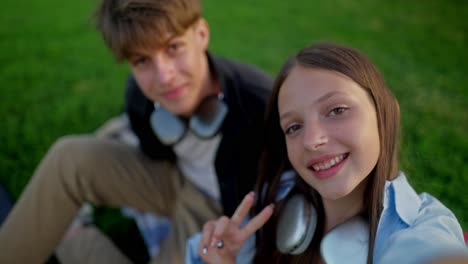 happy teenagers taking a selfie