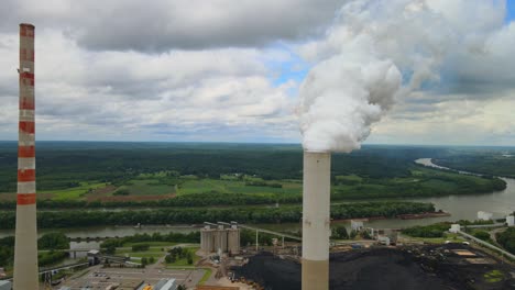 Close-up-aerial-orbit-of-smokestacks-at-fossil-plant