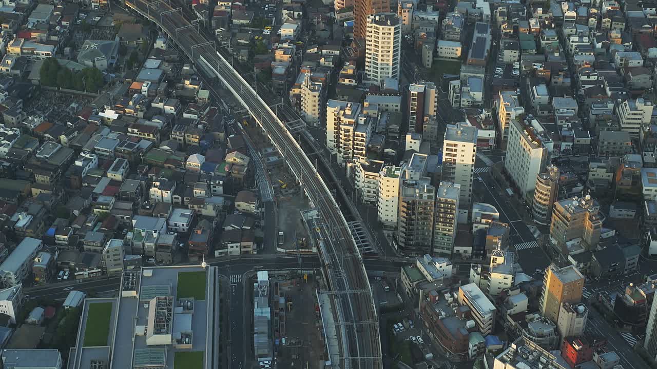 Railroad Tracks Along The City Buildings In Sumida, Tokyo, Japan. - high angle shot