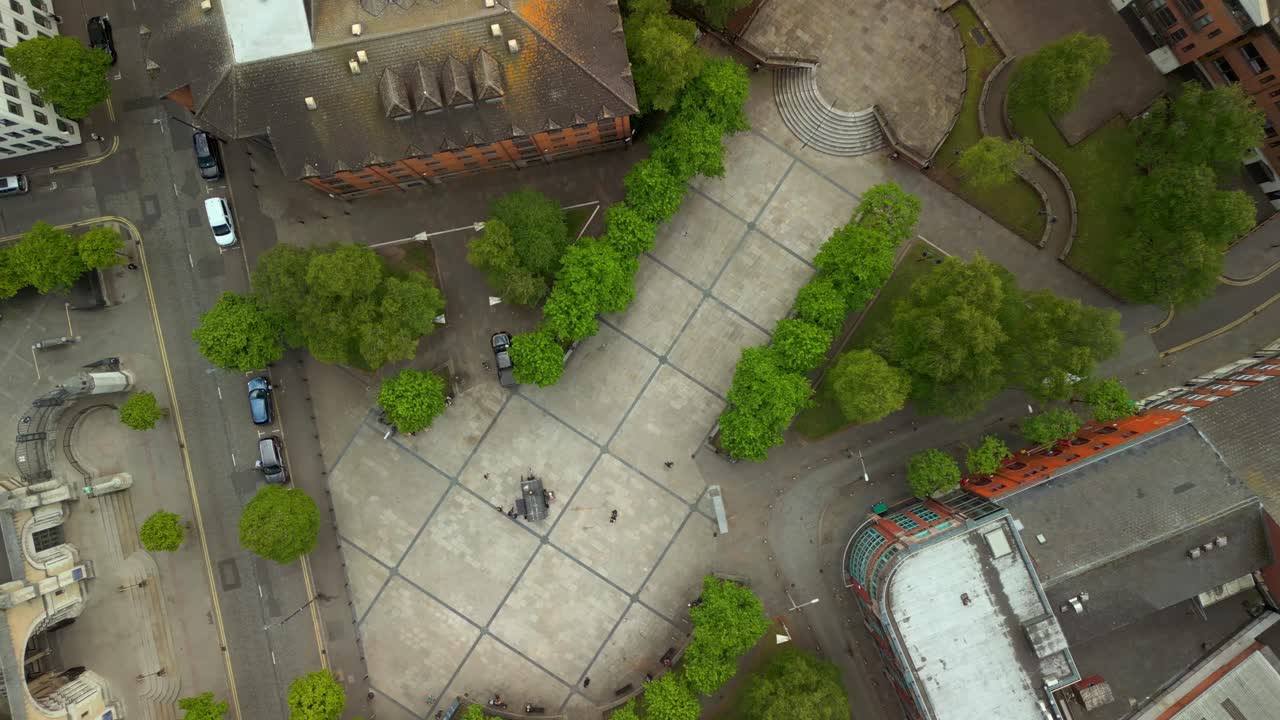 Descending aerial video of Writer's Square and St Anne's Cathedral in The Cathedral Quarter in Belfast, Northern Ireland, UK. Filmed in 4K, 60FPS and with Rec709 Color.