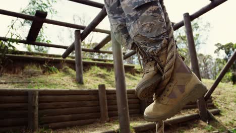 military soldiers climbing rope during obstacle course 4k